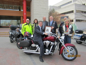 Ottawa Mayor Jim Watson has a seat on Big Red at Motorcycle Safety Awareness Month launch 2012